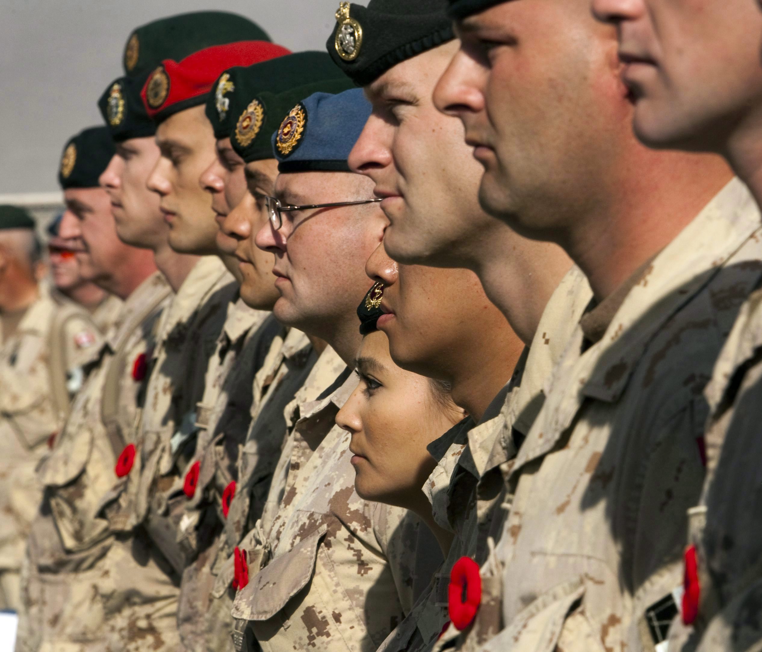 In this November 11, 2011 file photo, Canadian soldiers take part in the last Remembrance Day ceremony at Kandahar Air Field, Afghanistan. Without the mission in Afghanistan, what is in store for Canada's Department of National Defence in 2012? THE CANADIAN PRESS/Ryan Remiorz